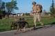 Staff Sgt. James Edwards, 319th Security Forces Squadron military working dog handler, participates in a Police Week ruck with his partner, Zorro, 319th SFS MWD, at Grand Forks Air Force Base, N.D., May 13, 2025.