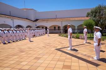 250522-N-FT324-7148. ROTA, SPAIN (May 22, 2025). Sailors from Navy Medicine Readiness and Training Command Rota stand in formation during the summer whites uniform inspection demonstrating pride and professionalism in their appearance and readiness. (U.S. Navy Photo by Mr. Everett Lopez/ Released by Lt. Cmdr. Alicia Sacks)