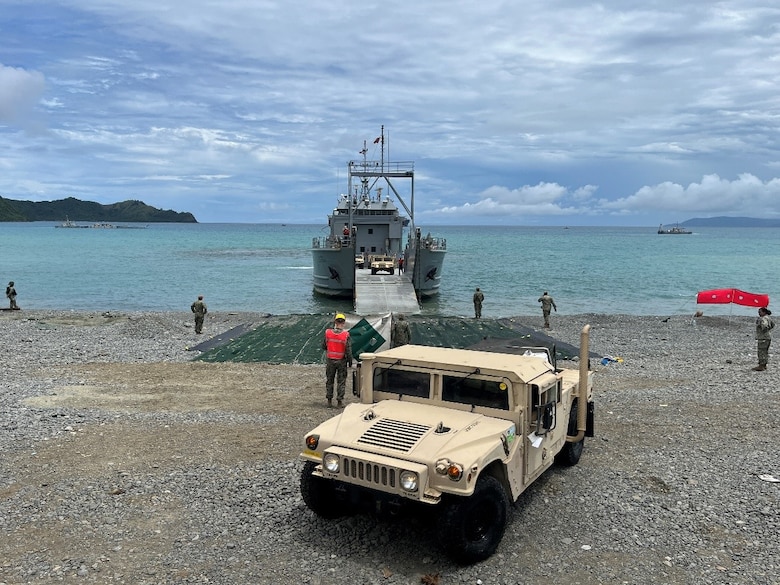 Army landing craft utility offloads a high-mobility multipurpose wheeled vehicle successfully across Submersible Matting (SUBMAT) during joint exercise Balikatan 25 in Dingalan, Philippines. The U.S. Army Engineer Research and Development Center’s SUBMAT team supported beach landing operations with in-person engineering and technical guidance of the SUBMAT system during this year’s exercise. (U.S. Marine Corps photo by Cpl. Brian Knowles)