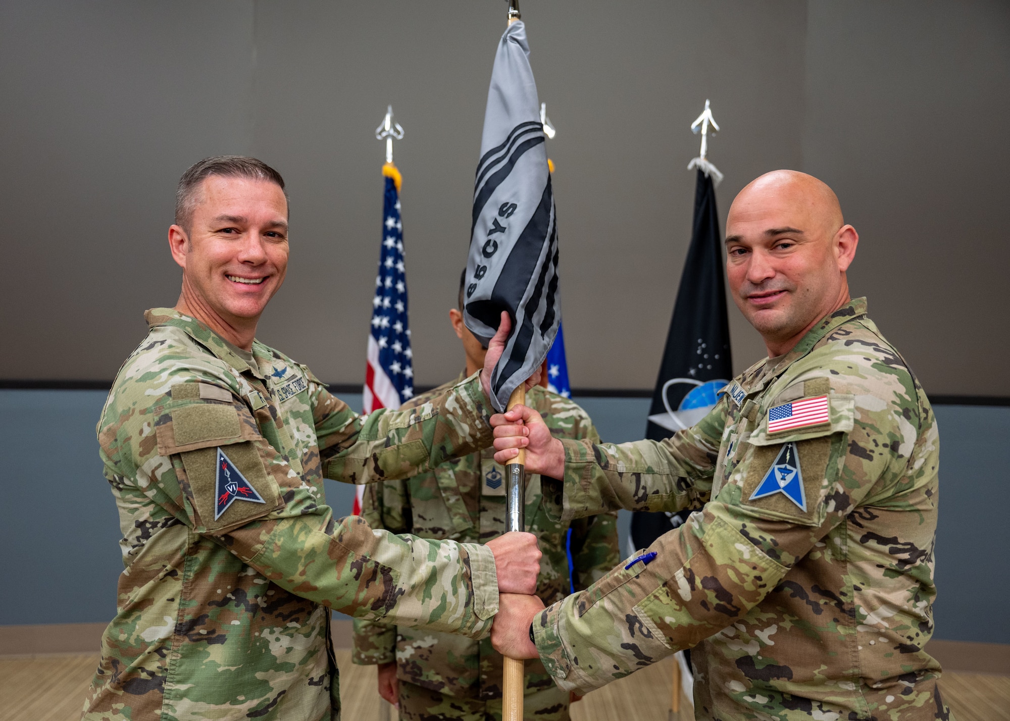 U.S. Space Force Lt. Col. Jacob Majewski, outgoing 65th Cyberspace Squadron commander, addresses attendees of the 65 CYS inactivation ceremony at Vandenberg Space Force Base, Calif., June 5, 2025. Majewski relinquished command of the 65th Cyberspace Squadron, signifying the inactivation of the unit and the activation of Space Delta 6 detachments 3 and 4.