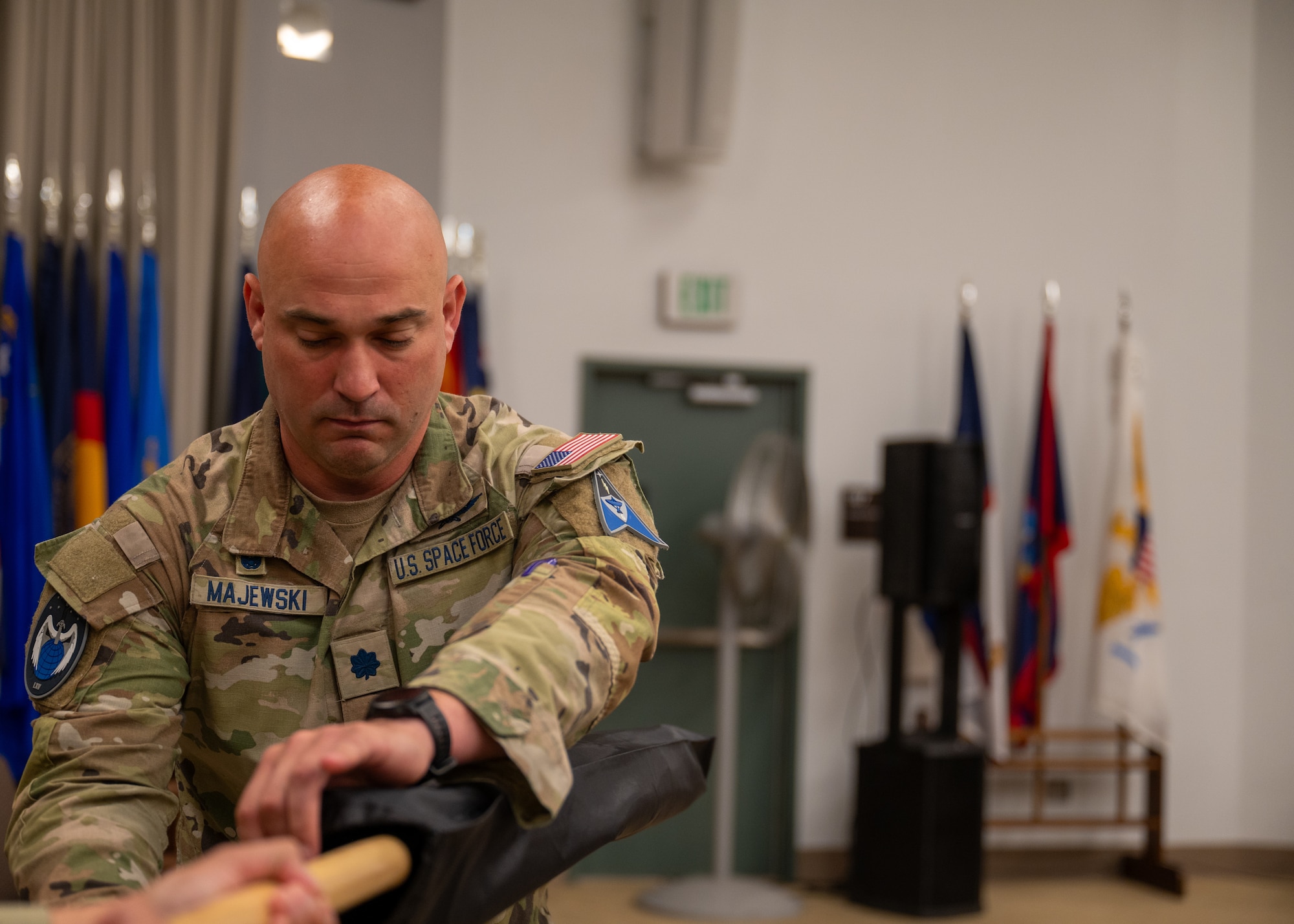 U.S. Space Force Lt. Col. Jacob Majewski, outgoing 65th Cyberspace Squadron commander, addresses attendees of the 65 CYS inactivation ceremony at Vandenberg Space Force Base, Calif., June 5, 2025. Majewski relinquished command of the 65th Cyberspace Squadron, signifying the inactivation of the unit and the activation of Space Delta 6 detachments 3 and 4.