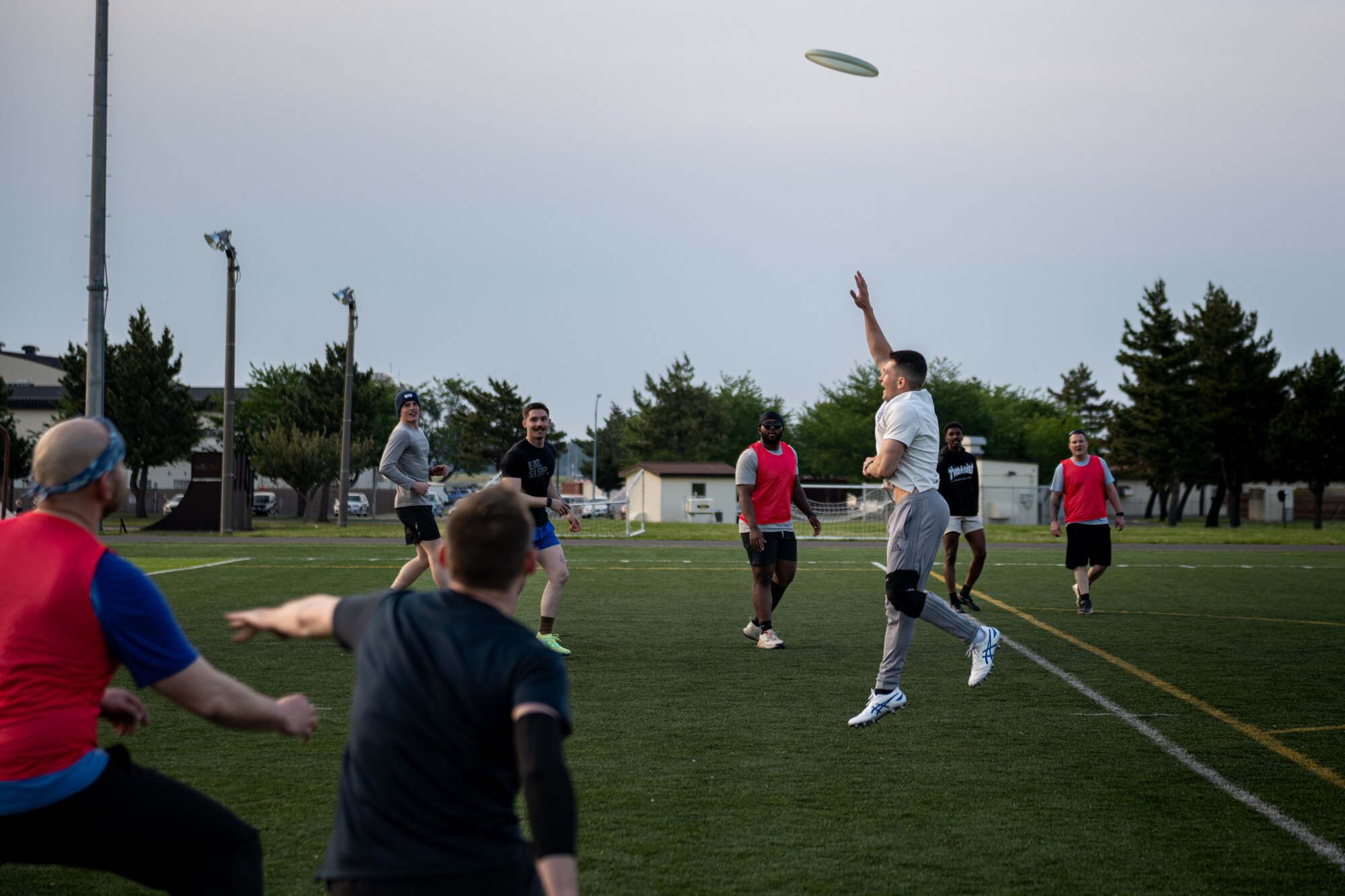 Participants of Sakura Olympics 2025 compete in a game of ultimate frisbee.