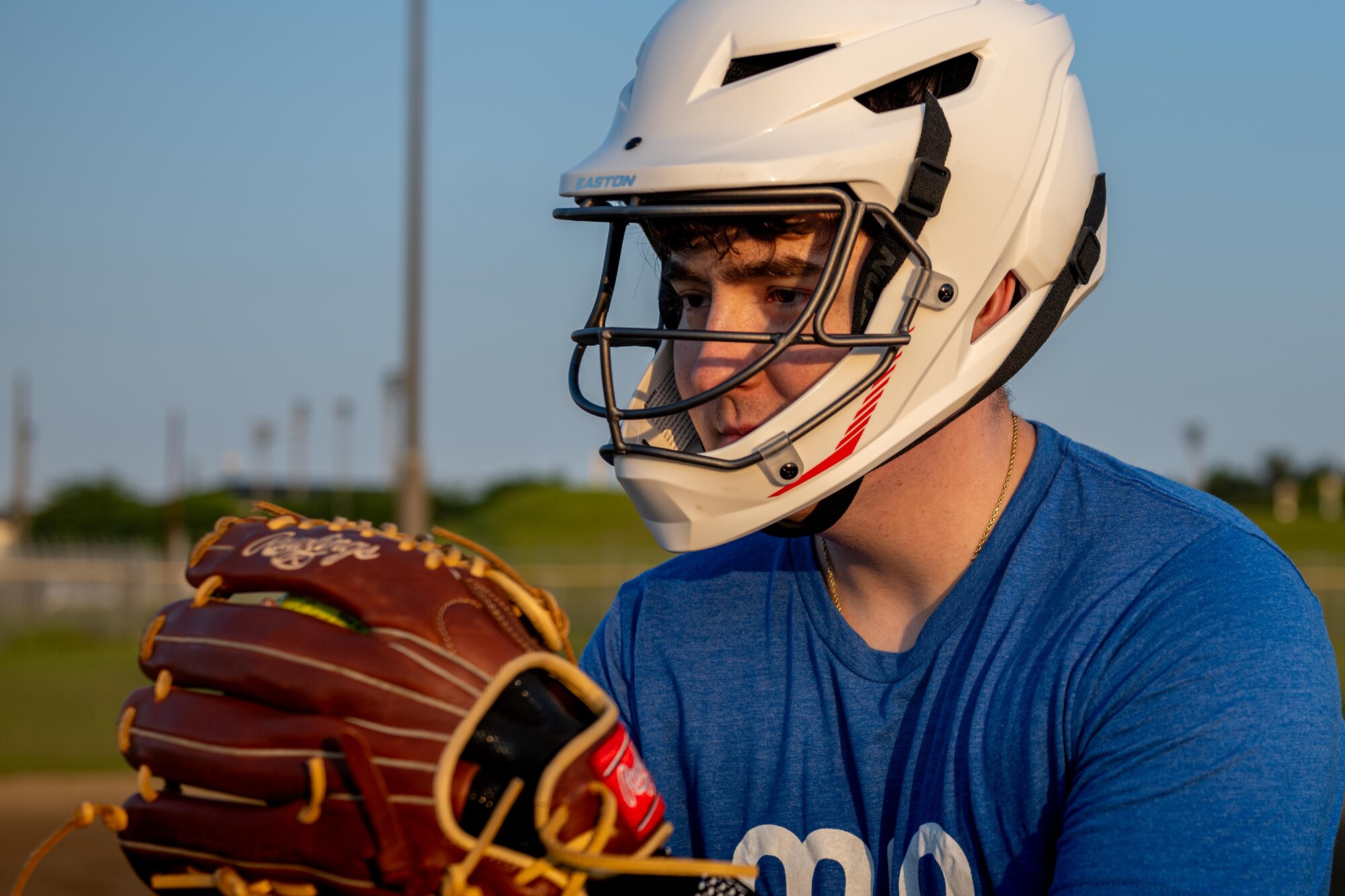A participant of Sakura Olympics 2025 prepares to pitch a ball in a game of softball.