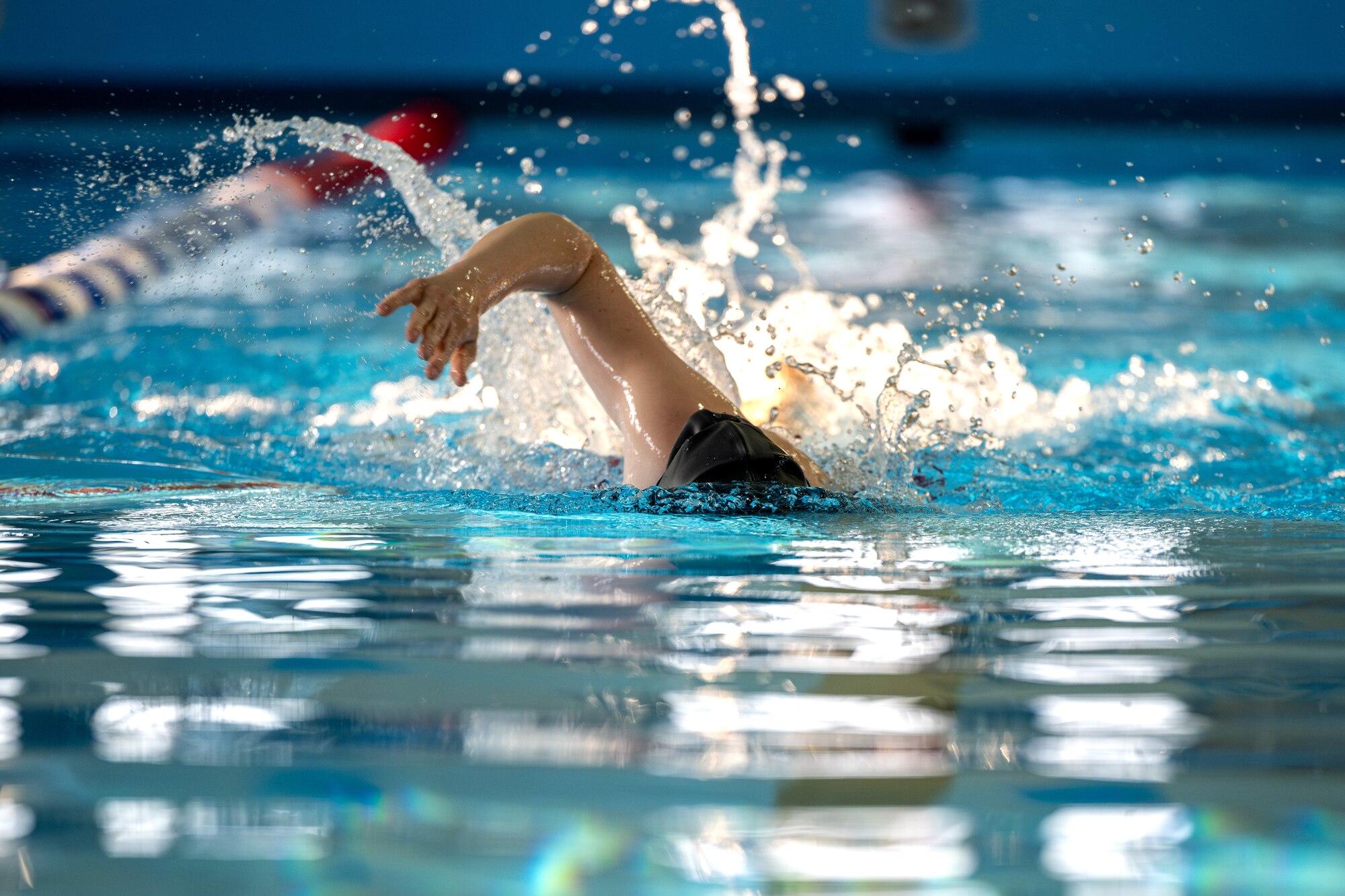 A participant of Sakura Olympics 2025 competes in a swimming competition.