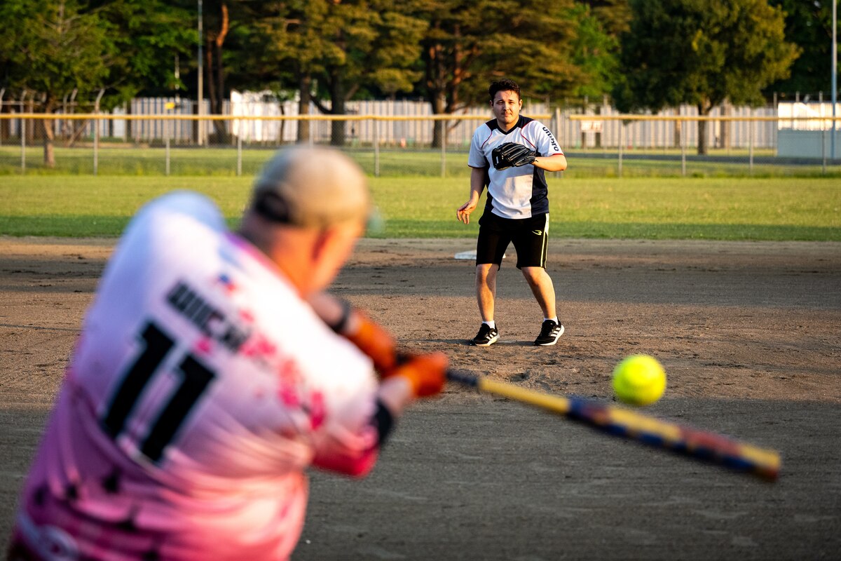 Participants of Sakura Olympics 2025 play softball.