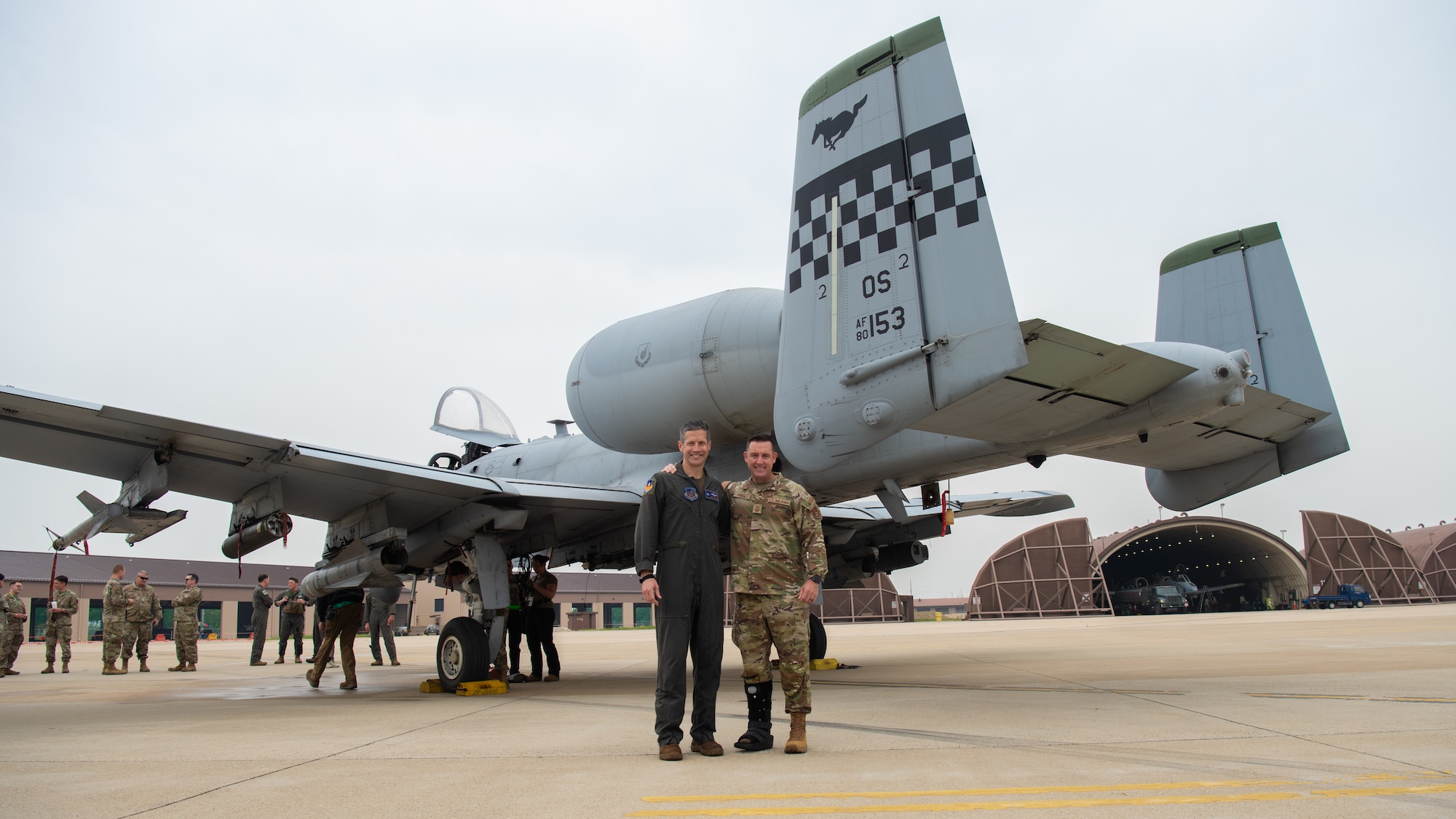U.S. Air Force Col. William McKibban, 51st Fighter Wing commander, and Chief Master Sgt. Joshua Trundle, 51st Fighter Wing command chief, pose beside the A-10 Thunderbolt II following McKibban’s fini flight at Osan Air Base, Republic of Korea, June 2, 2025.