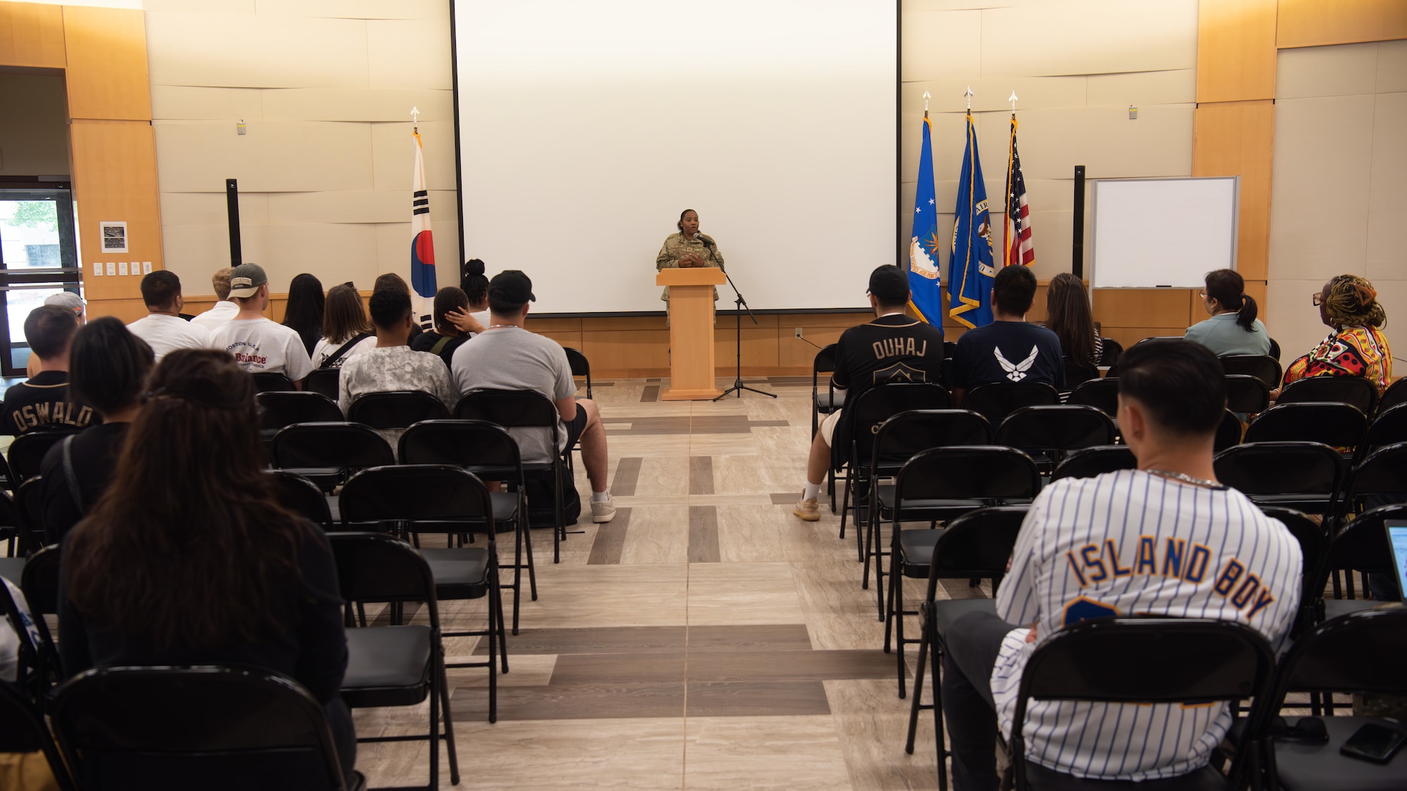 U.S. Air Force Technical Sgt. Nelanie Dillard, noncommissioned officer in charge of command support staff, 303rd Intelligence Squadron, delivers opening remarks and shares her story about her struggles with mental health for MINDFUL MADNESS at Osan Air Base, Republic of Korea, May 30, 2025.