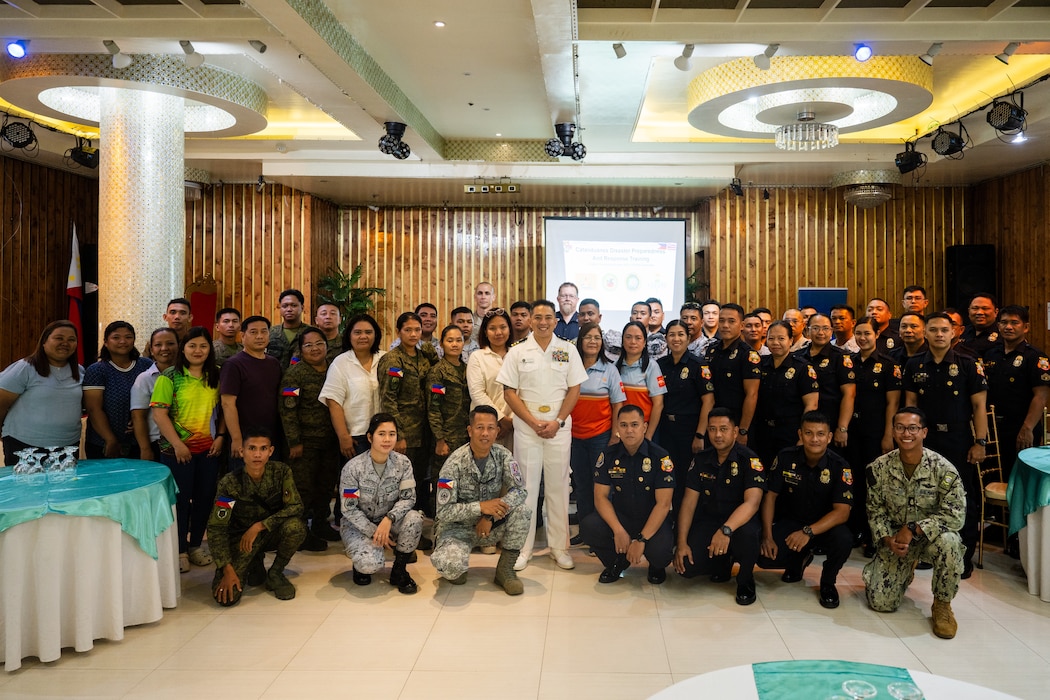 Pacific Partnership 2025 service members, Armed Forces of the Philippines personnel, local emergency responders, and civilian authorities pose for a photo before an Incident Command Systems training in Virac, Philippines, June 2, 2025.