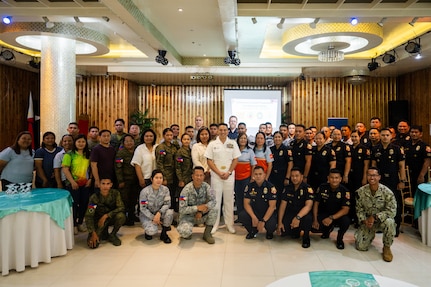 Pacific Partnership 2025 service members, Armed Forces of the Philippines personnel, local emergency responders, and civilian authorities pose for a photo before an Incident Command Systems training in Virac, Philippines, June 2, 2025.