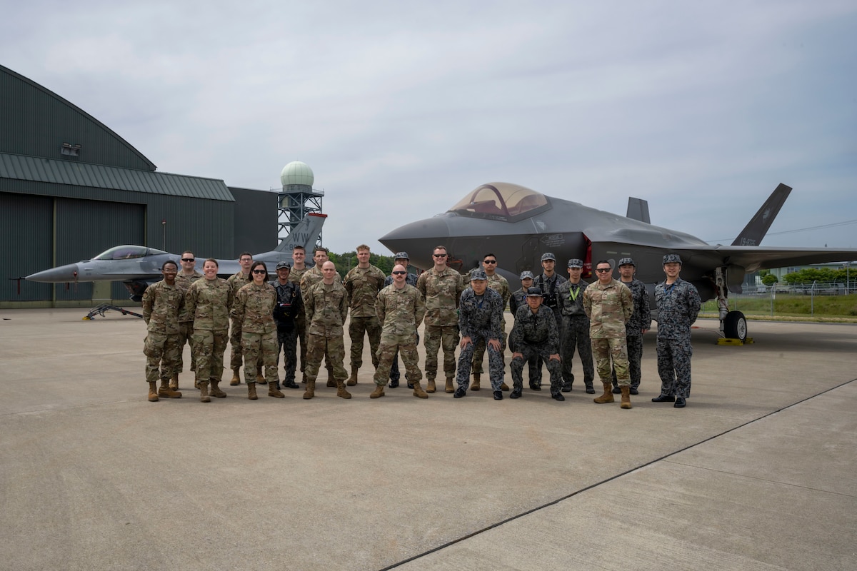 Members of the 13th Fighter Generation Squadron and 35th Logistics Readiness Squadron stand beside members of the Japan Air Self-Defense Force 3rd Air Wing for a group photo during a refueling interoperability demonstration at Misawa Air Base, Japan, May 30, 2025.