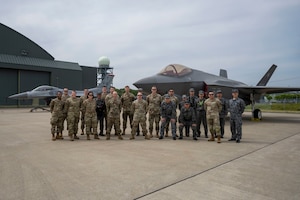 Members of the 13th Fighter Generation Squadron and 35th Logistics Readiness Squadron stand beside members of the Japan Air Self-Defense Force 3rd Air Wing for a group photo during a refueling interoperability demonstration at Misawa Air Base, Japan, May 30, 2025.