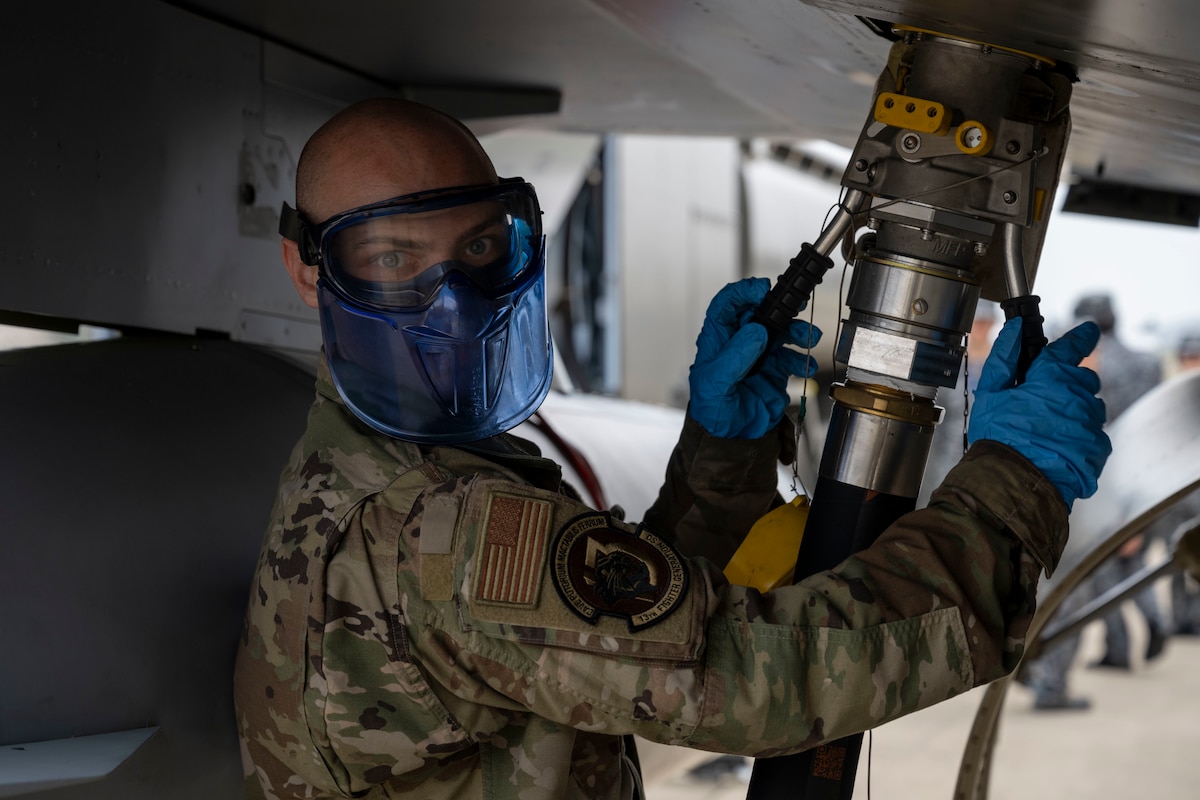 U.S. Air Force Staff Sgt. Anthony Loren, 13th Fighter Generation Squadron dedicated crew chief, refuels a 13th Fighter Squadron F-16 Fighting Falcon during a refueling interoperability demonstration at Misawa Air Base, Japan, May 30, 2025.