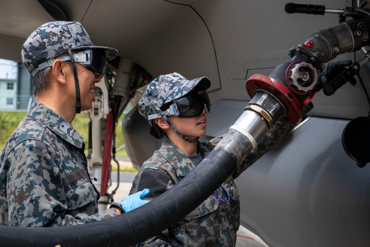 Japan Air Self-Defense Force (JASDF) fuels specialists assigned to the 3rd Air Wing refuels a JASDF Lightning II during a refueling interoperability demonstration at Misawa Air Base, Japan, May 30, 2025.