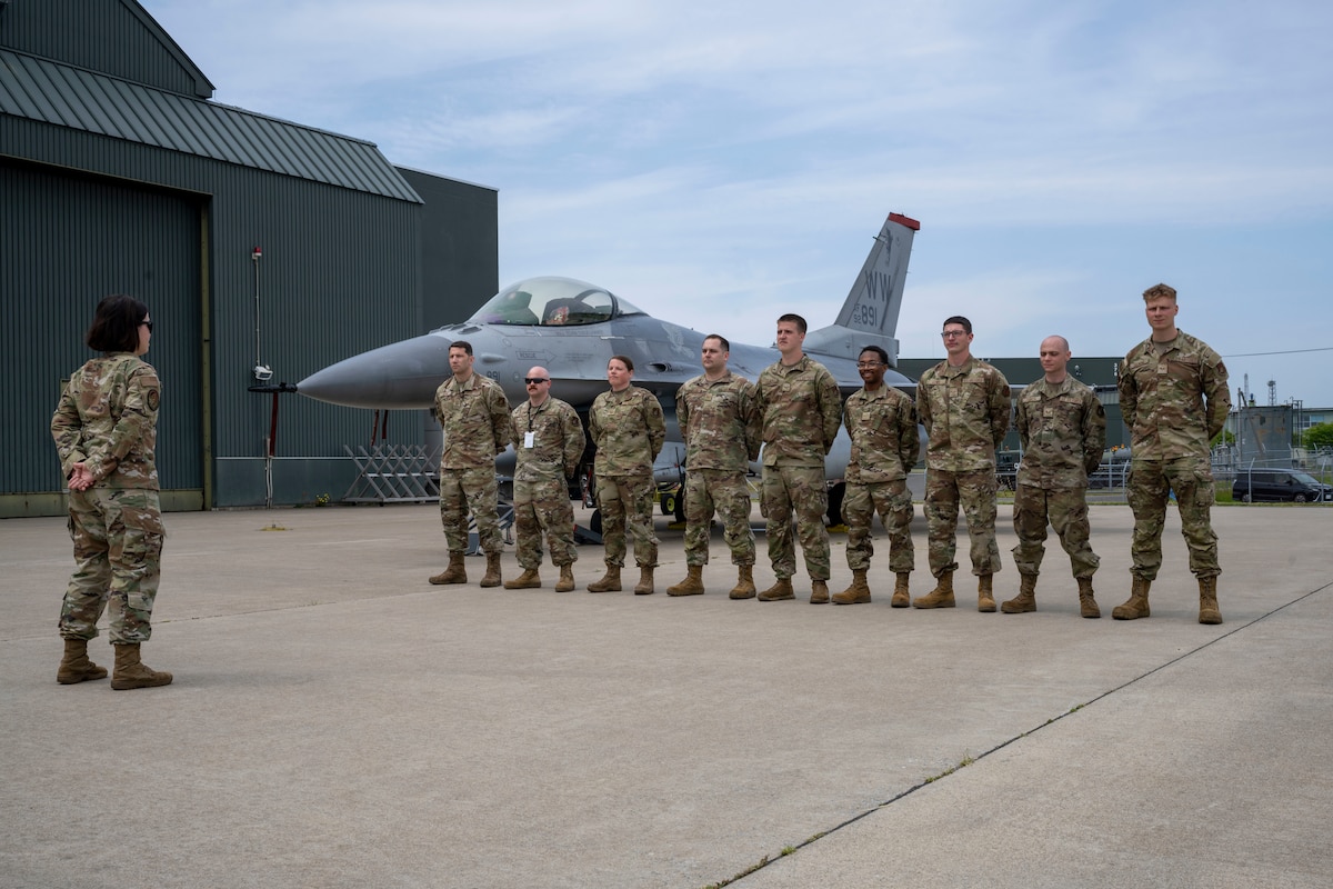U.S. Air Force Airmen assigned to the 35th Logistics Readiness Squadron fuels management flight and 13th Fighter Generation Squadron stand ready beside a 13th Fighter Squadron F-16 Fighting Falcon during a fuels interoperability demonstration at Misawa Air Base, Japan, May 30, 2025.