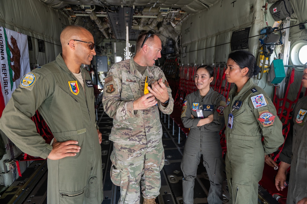 U.S. Air Force airmen assigned with the 129th Rescue Wing, California Air National Guard, and Philippine Air Force airmen conduct a static tour of the HC-130J during Exercise Balikatan '25, Cebu City, Philippines, Apr. 29, 2025.