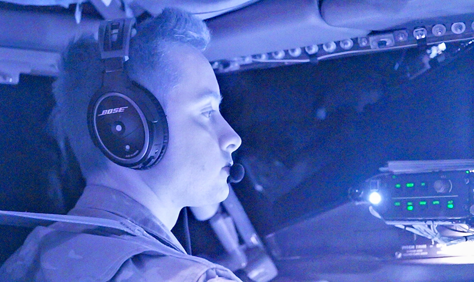 A U.S. Air Force servicemember pilots an aircraft.