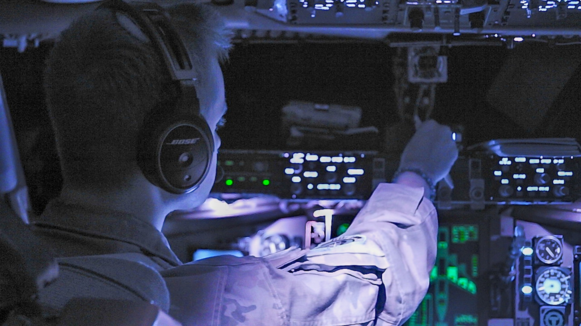 A U.S. Air Force Airman pilots an aircraft.