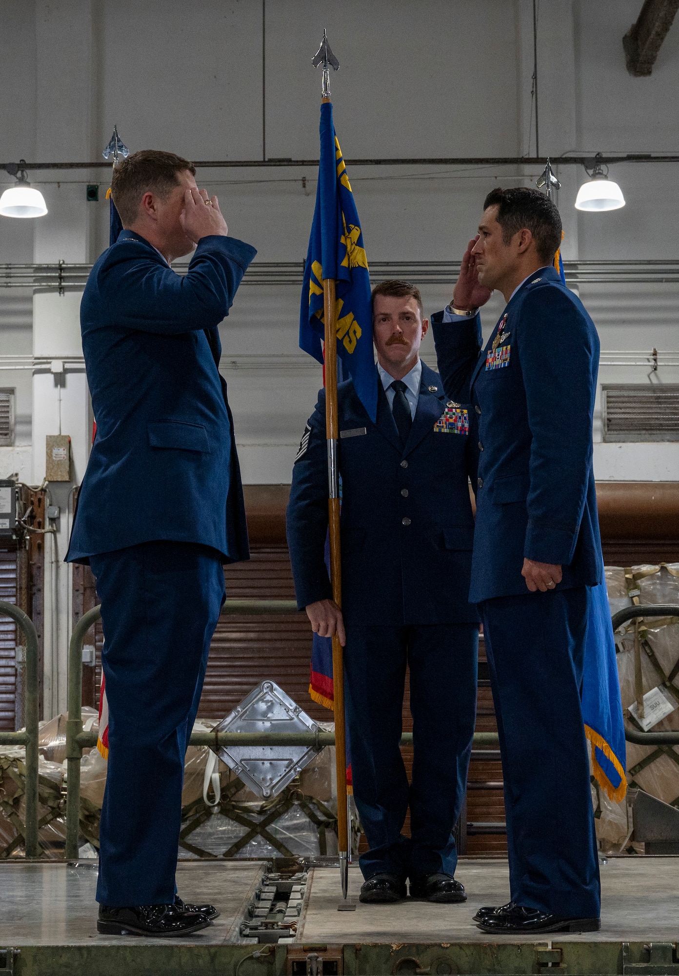 Col. Troy Pierce, commander of the 715th Air Mobility Operations Group, salutes Lt. Col. Michael Sadler, outgoing commander of the 734th Air Mobility Squadron during a change of command ceremony at Andersen Air Force Base, Guam, June 4, 2025.