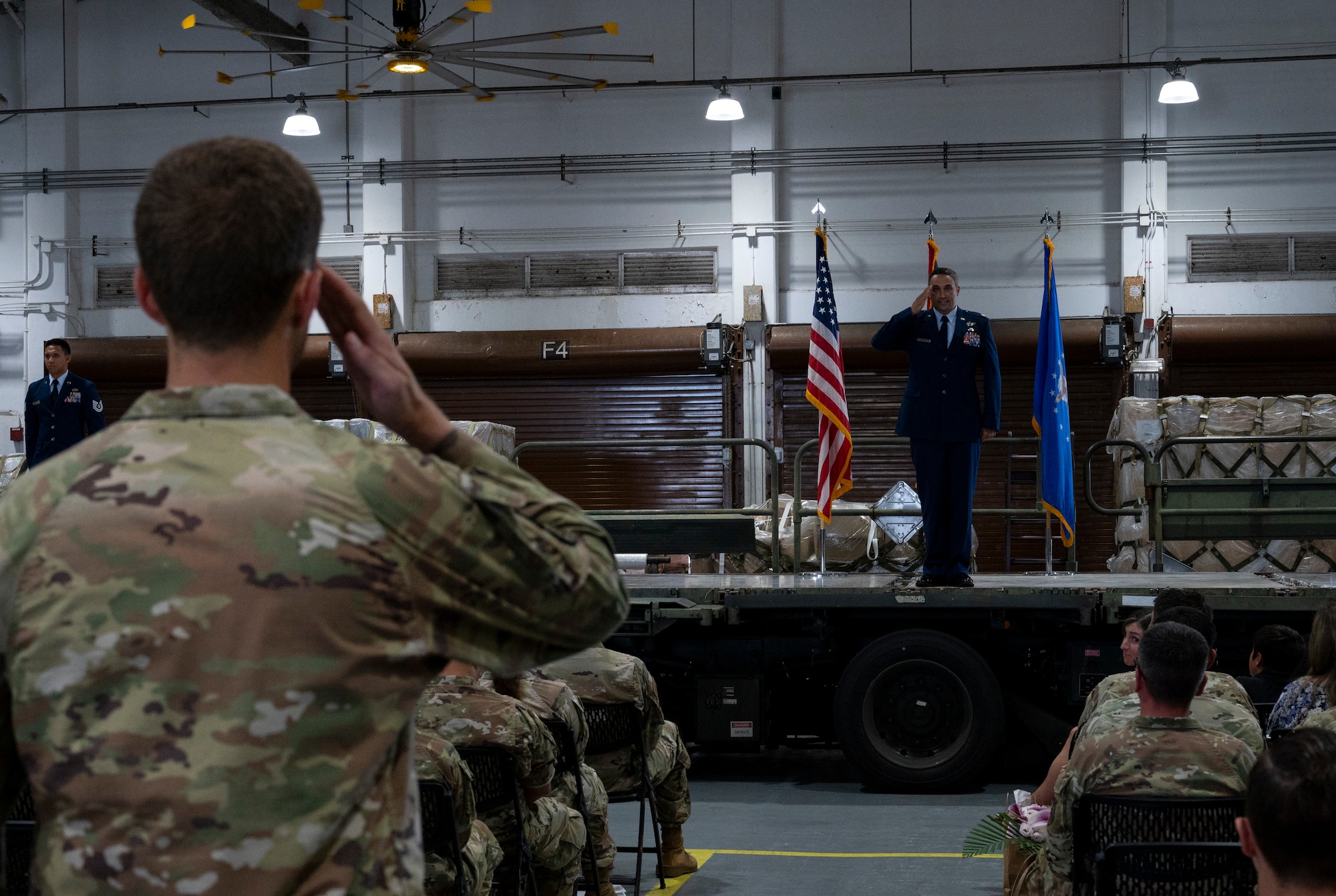 From left, Capt. Nicholas Westrick, 734th AMS Maintenance director of operations, renders the first salute to Lt. Col. Geoffrey Britzke, new commander of the 734th Air Mobility Squadron, during a change of command ceremony at Andersen Air Force Base, Guam, June 4, 2025.