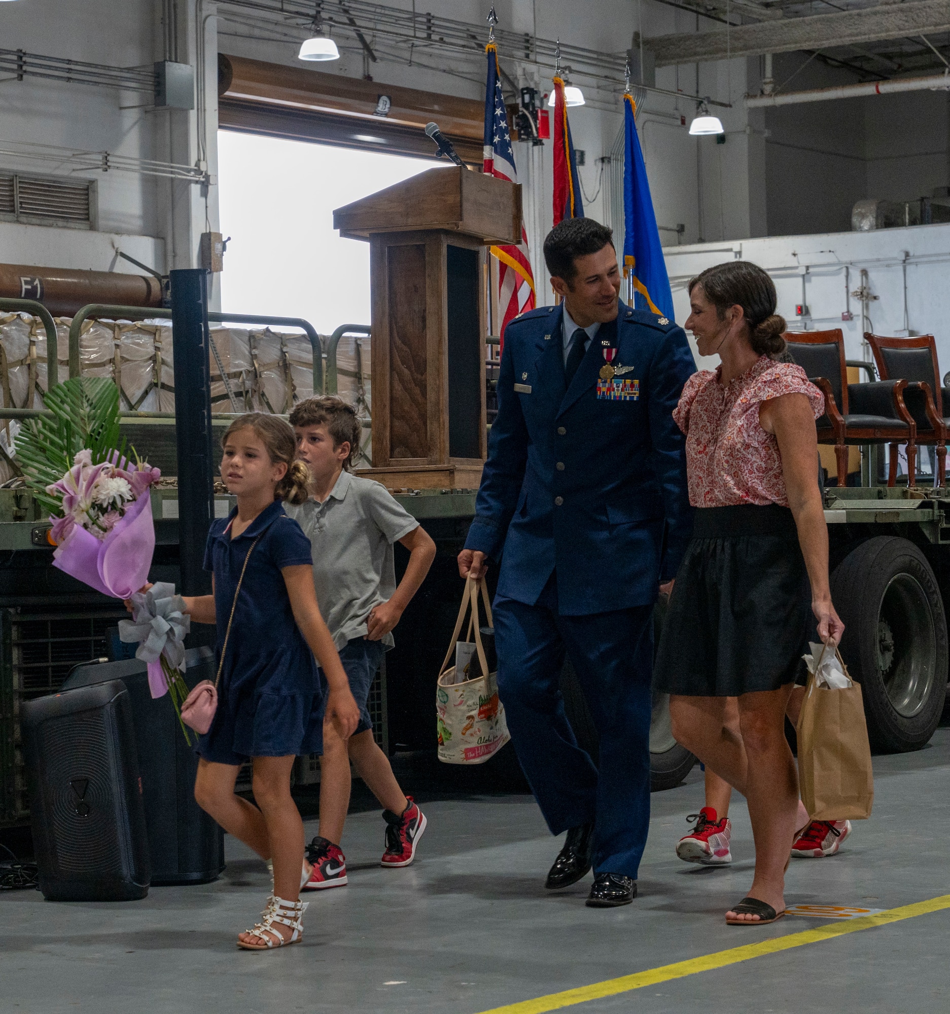 Lt. Col. Michael Sadler, former commander of the 734th Air Mobility Squadron, leaves a change of command ceremony with his family at Andersen Air Force Base, Guam, June 4, 2025.