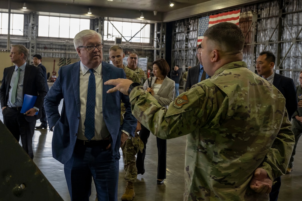 George Glass, left, U.S. Ambassador to Japan, listens as U.S. Air Force Master Sgt. Alexander Manco, 35th Civil Engineer Squadron (CES) prime base engineer emergency force manager, explains the role the 35th CES plays at Misawa Air Base, Japan, June 5, 2025.