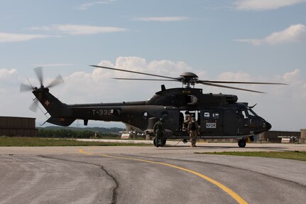 U.S., Hungarian and Swiss aviation forces assigned to the NATO-led Kosovo Force mission, also known as KFOR, conduct an international partner multi-ship familiarization flight, or IPMFF, around Camp Bondsteel, Kosovo, May 12, 2025.