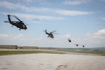 U.S., Hungarian and Swiss aviation forces assigned to the NATO-led Kosovo Force mission, also known as KFOR, conduct an international partner multi-ship familiarization flight, or IPMFF, around Camp Bondsteel, Kosovo, May 12, 2025. The U.S. troops were flying the UH-60 Blackhawk, the Hungarian troops were flying the H-145M helicopter, and the Swiss troops were flying the H-215 Cougar.