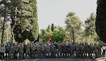 Service members from the Maine National Guard, Vermont National Guard, Armed Forces of Montenegro, and the Army of the Republic of North Macedonia pose for a group photo before beginning a cyber training exercise during Immediate Response 25 at Golubovci Air Base, Montenegro, June 2, 2025. The cyber exercise was developed and facilitated as a combined effort between the Maine National Guard and the Armed Forces of Montenegro through the State Partnership Program (SPP). The Vermont National Guard and the Army of the Republic of Macedonia, SPP partners since 1993, also participated in the exercise.