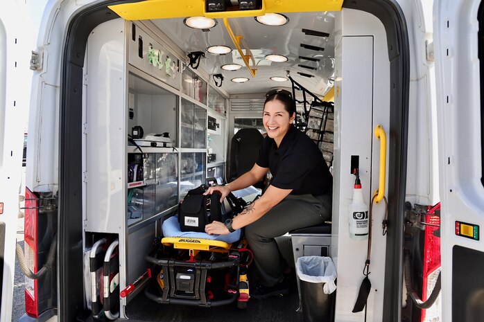 Hospitalman Jessica Sanderson, from San Tan Valley, Arizona, gears up for her first day in the field as part of a groundbreaking ride-along partnership between NMRTC Twentynine Palms and the Morongo Basin Ambulance Association, June 5, 2025. The program places Navy corpsmen alongside seasoned paramedics during real emergency calls across a 2,700-square-mile region, providing hands-on experience that sharpens clinical judgment, builds operational readiness, and strengthens military-civilian medical collaboration (U.S. Navy photo by Christopher C. Jones, NHTP/NMRTC Twentynine Palms public affairs officer).