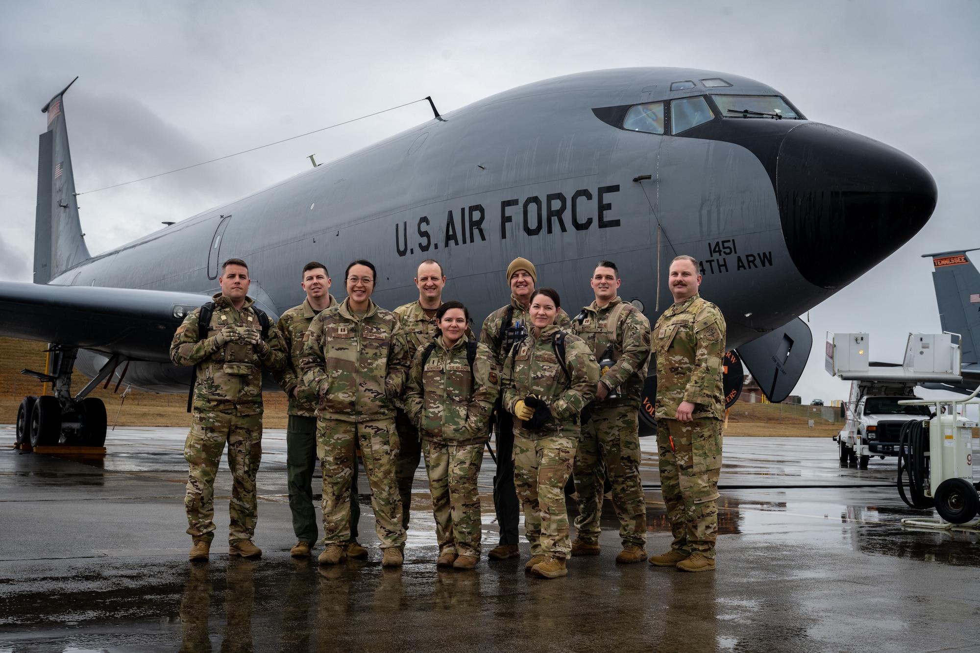 Members of the 134th ARW CCATT stand in front of a KC-135 stratotanker.