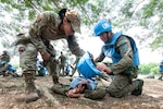U.S. Air Force Staff Sgt. Maritza Garcia, 154th Medical Group Detachment 1 medic and Tactical Combat Casualty Care instructor, evaluates Armed Forces of the Philippines students during a medical field training exercise May 29, 2025, at Camp O’Donnell, Philippines. The training emphasized rapid response and effective medical treatment in high-pressure environments.