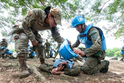 U.S. Air Force Staff Sgt. Maritza Garcia, 154th Medical Group Detachment 1 medic and Tactical Combat Casualty Care instructor, evaluates Armed Forces of the Philippines students during a medical field training exercise May 29, 2025, at Camp O’Donnell, Philippines.