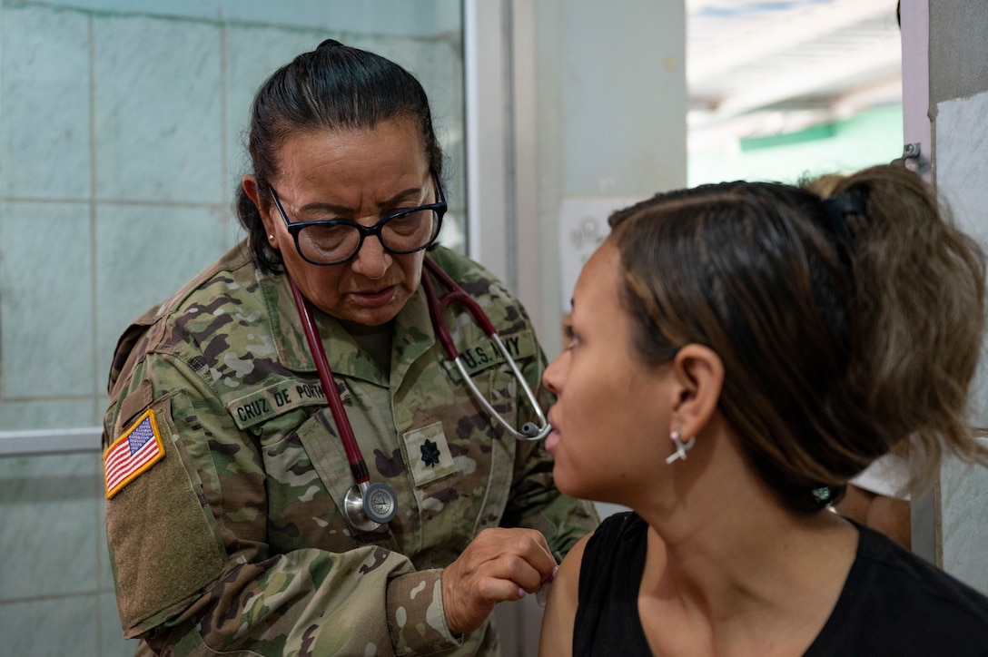 U.S. Army Lt. Col. Maria Cruz De Portillo, Joint Task Force-Bravo registered nurse, gives immunizations to a local Honduran patient during a medical mission in Comayagua, Honduras, May 29, 2025. Since 1992, JTF-Bravo has helped to improve overall public health in Central America, which is integral to long-term regional stability. (U.S. Air Force photo by Staff Sgt. Sadie Colbert)