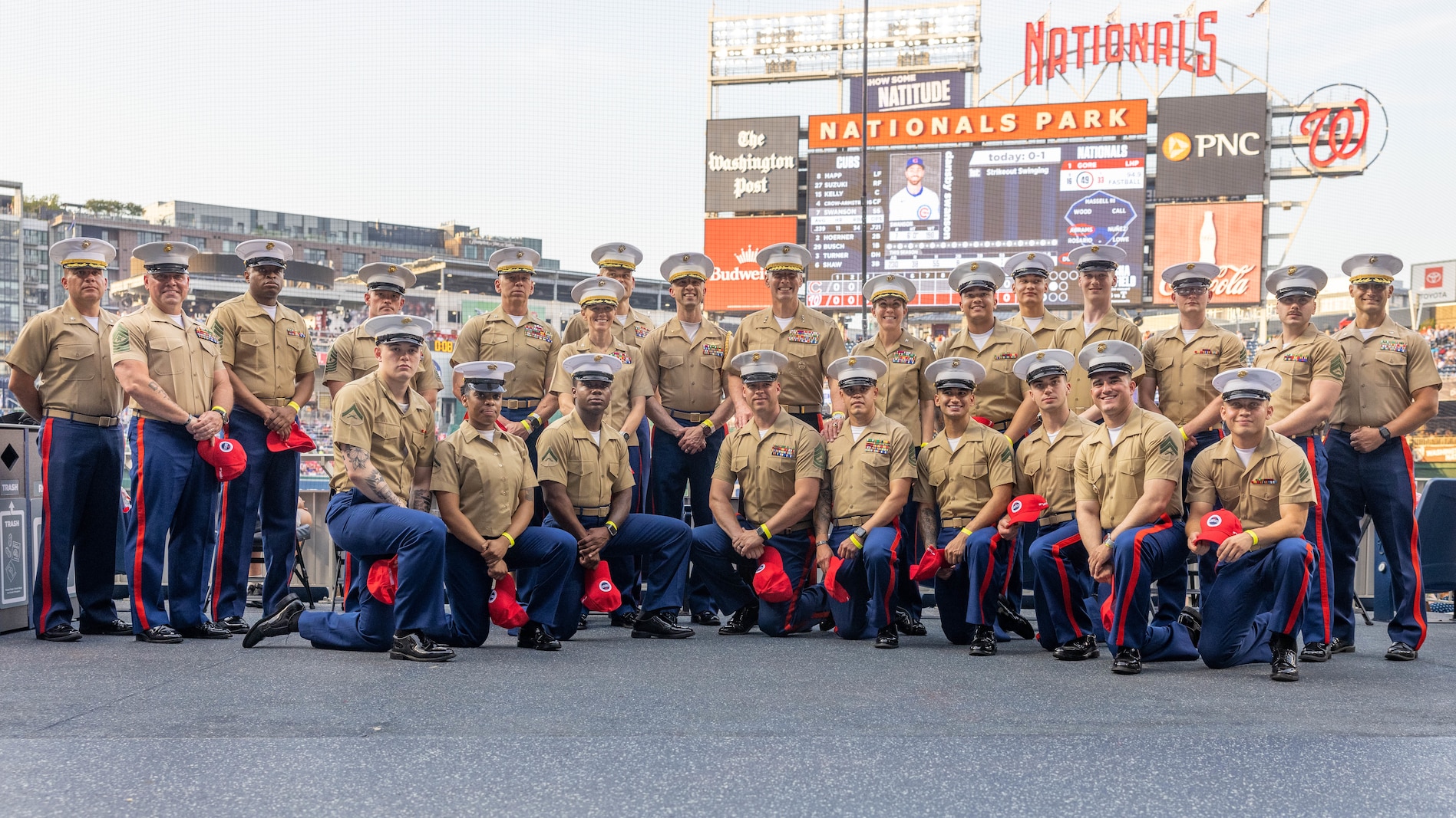U.S. Marines pose for a photo during the baseball game for Marine Day at the Nationals Park, Washington D.C., June 4, 2025. Marine Day is held to demonstrate unique Marine Corps capabilities, develop enduring relationships with our community, and showcase Esprit De Corps. (U.S. Marine Corps photo by Lance Cpl. Harleigh Faulk)