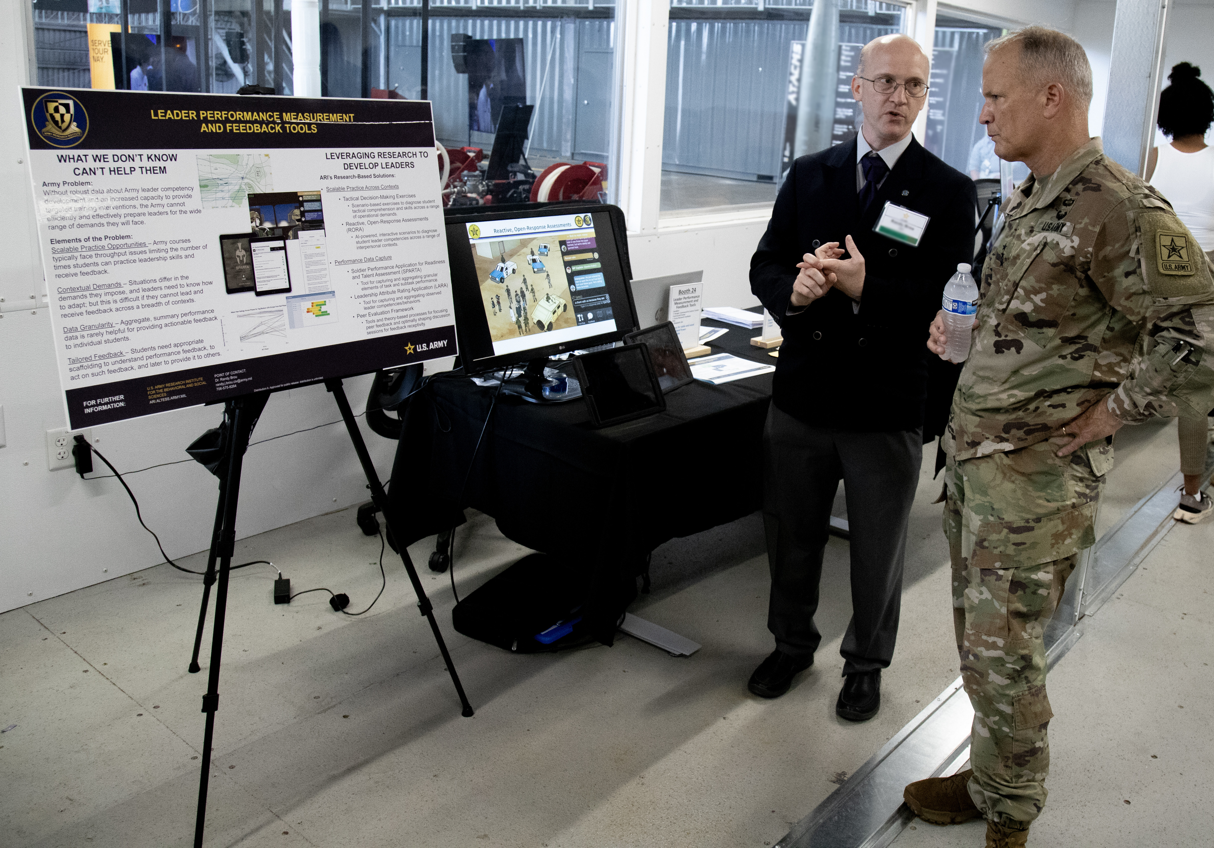 U.S. Army Research Institute for the Behavioral and Social Sciences, Fort Benning Research Unit Chief, Dr. Randy Brou demonstrates feedback tool to U.S. Army, Commanding General, U.S. Army Futures Command, Major General John M. Cushing