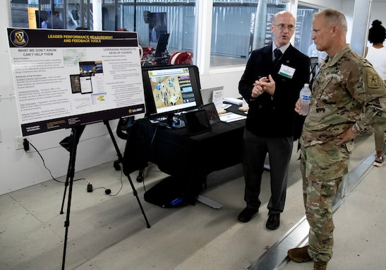U.S. Army Research Institute for the Behavioral and Social Sciences, Fort Benning Research Unit Chief, Dr. Randy Brou demonstrates a feedback tool to U.S. Army, Commanding General, U.S. Army Futures Command, Major General John M. Cushing