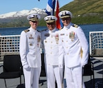 Vice Adm. Andrew Tiongson, commander, Coast Guard Pacific Area, stands with Cmdr. Steven Baldovsky, outgoing commanding officer of Coast Guard Cutter Alex Haley (WMEC-39) and Cmdr. Stephen Brickey, incoming commanding officer, during the change of command ceremony for Alex Haley in Kodiak, Alaska, June 5, 2025. Alex Haley is a 282-foot Medium Endurance Cutter that performs search and rescue, fisheries law enforcement, and maritime security. (U.S. Coast Guard photo by Lt. j.g. John Walsh).