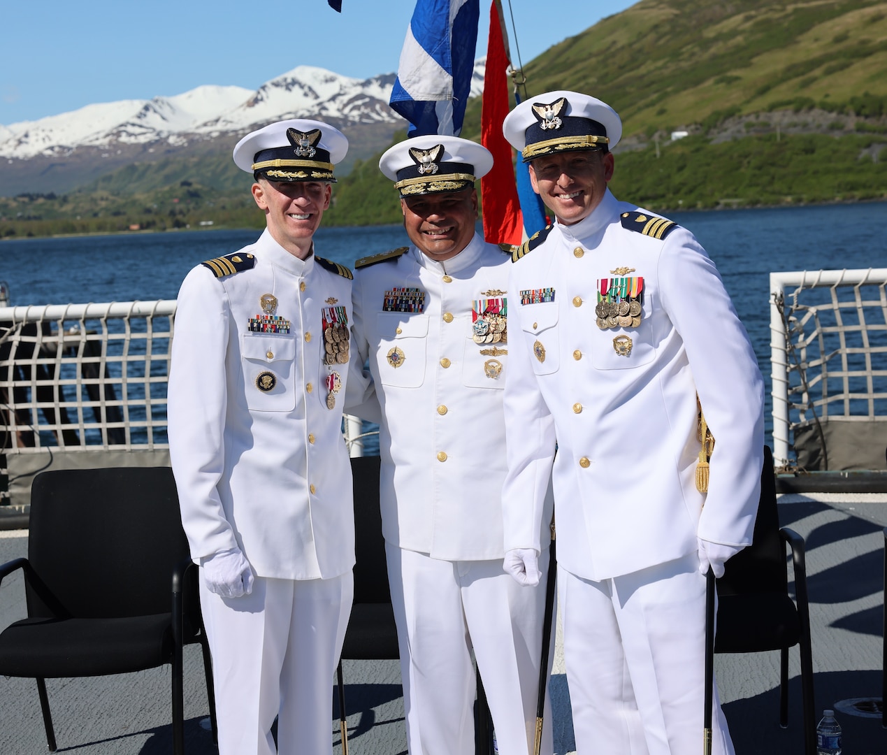Vice Adm. Andrew Tiongson, commander, Coast Guard Pacific Area, stands with Cmdr. Steven Baldovsky, outgoing commanding officer of Coast Guard Cutter Alex Haley (WMEC-39) and Cmdr. Stephen Brickey, incoming commanding officer, during the change of command ceremony for Alex Haley in Kodiak, Alaska, June 5, 2025. Alex Haley is a 282-foot Medium Endurance Cutter that performs search and rescue, fisheries law enforcement, and maritime security. (U.S. Coast Guard photo by Lt. j.g. John Walsh).