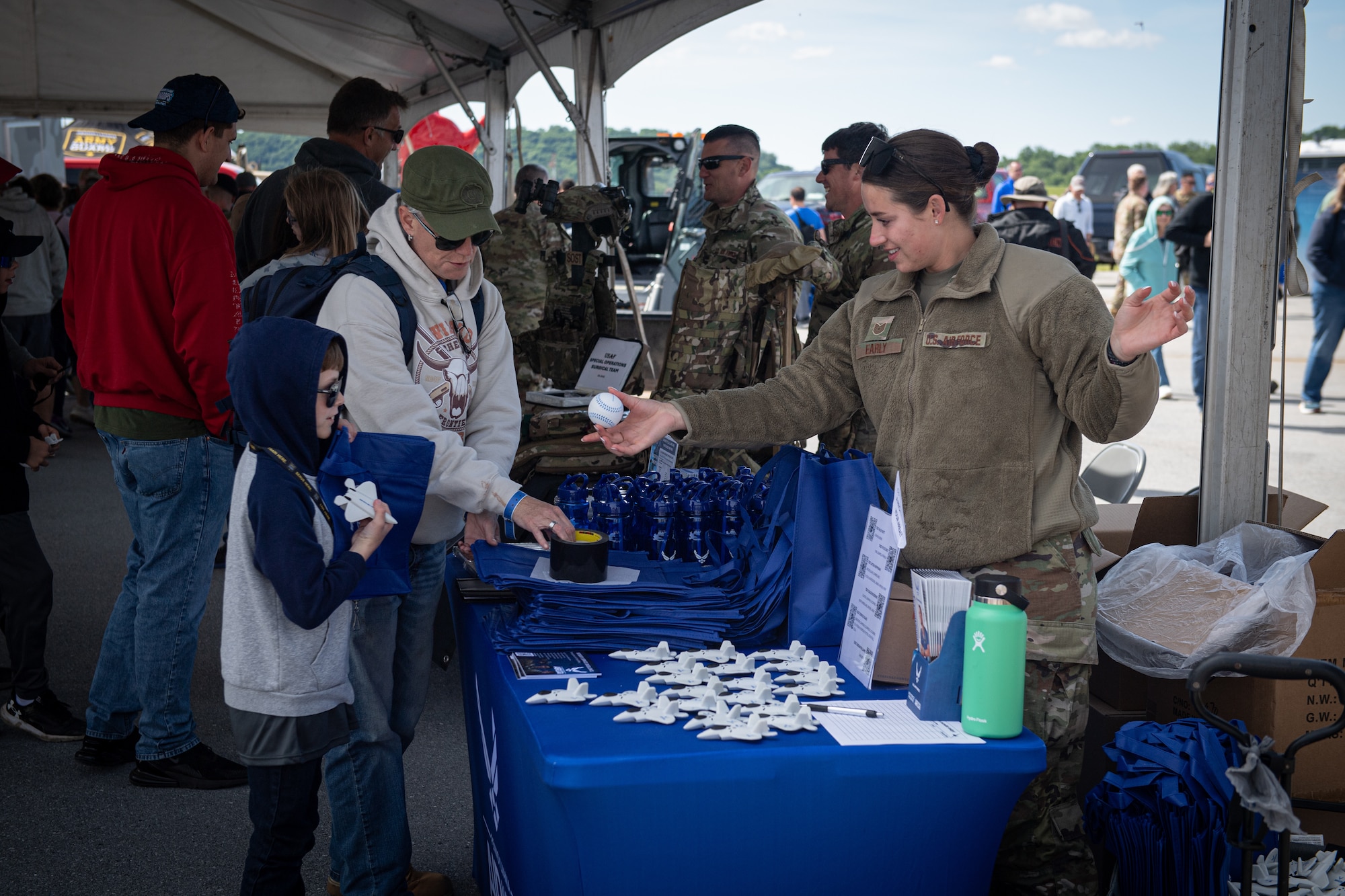 U.S. Air Force Tech. Sgt. Kylie Early, a recruiter with the 193rd Special Operations Wing, interacts with patrons during an air show at Harrisburg International Airport in Middletown.