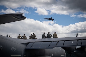 Airmen from the 193rd Special Operations Wing watch the U.S. Navy’s Blue Angels aerial demonstration team perform during an air show at Harrisburg International Airport in Middletown