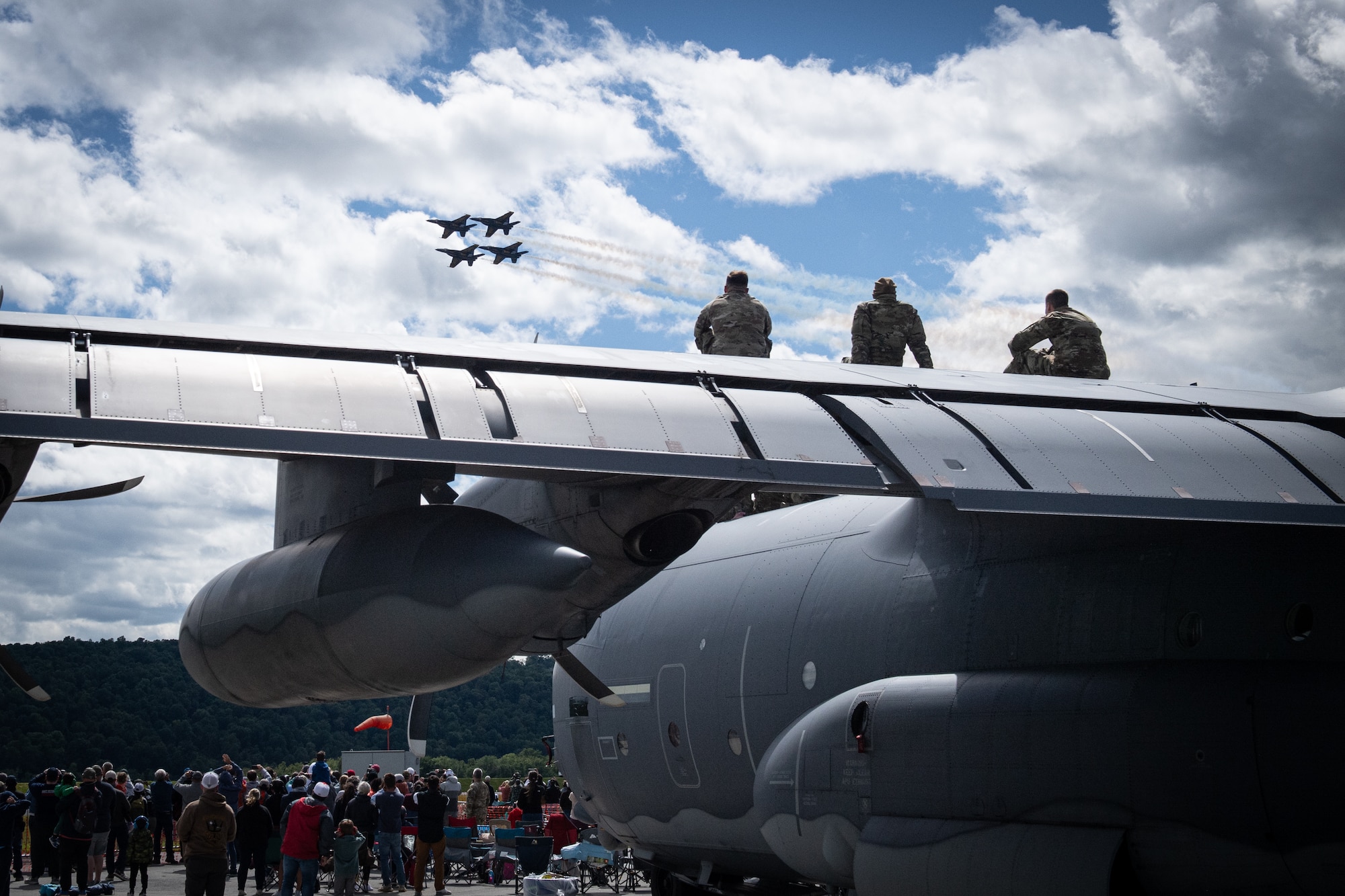 Airmen from the 193rd Special Operations Wing watch the U.S. Navy’s Blue Angels aerial demonstration team perform during an air show at Harrisburg International Airport in Middletown.