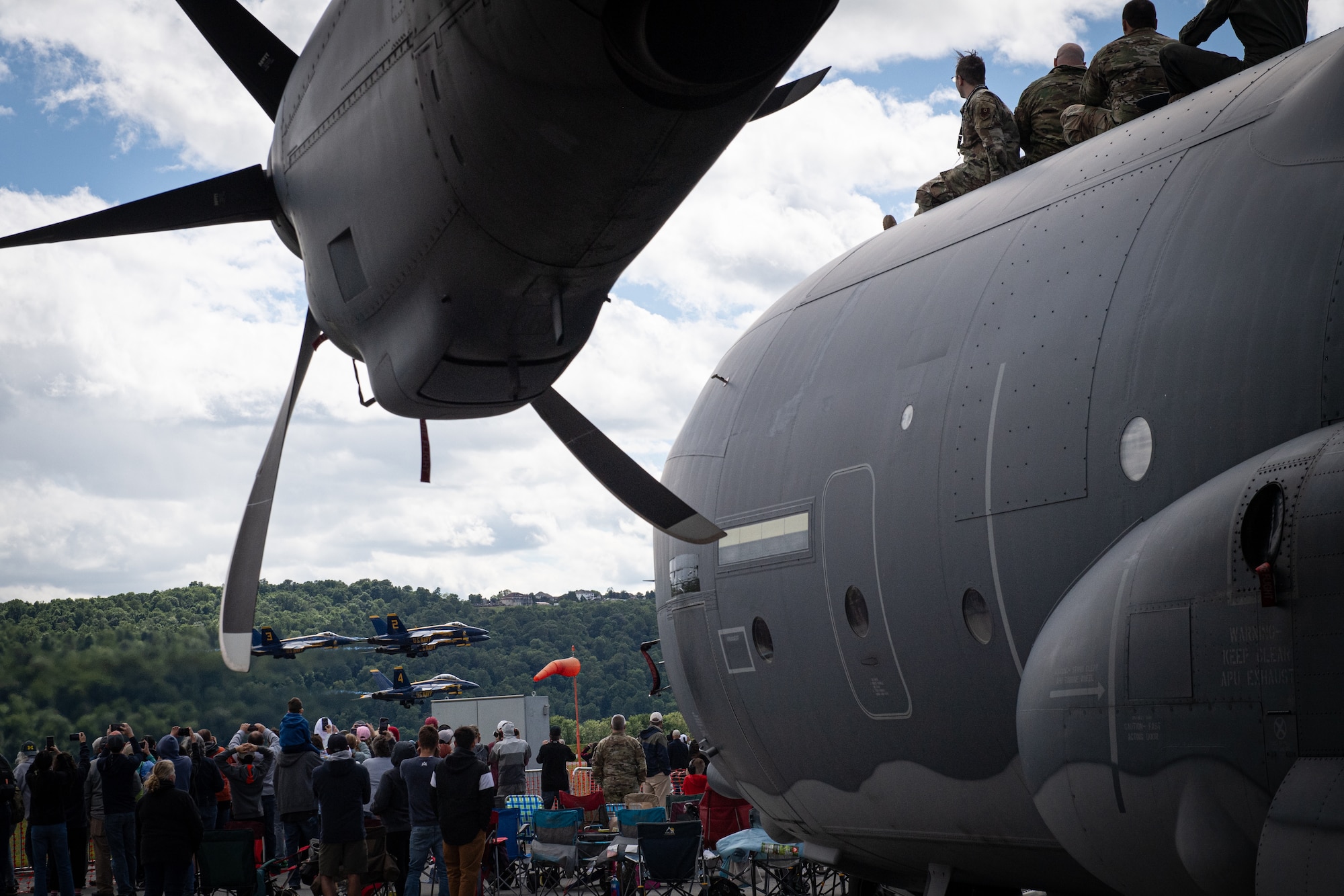 Airmen from the 193rd Special Operations Wing watch the U.S. Navy’s Blue Angels aerial demonstration team perform during an air show at Harrisburg International Airport in Middletown