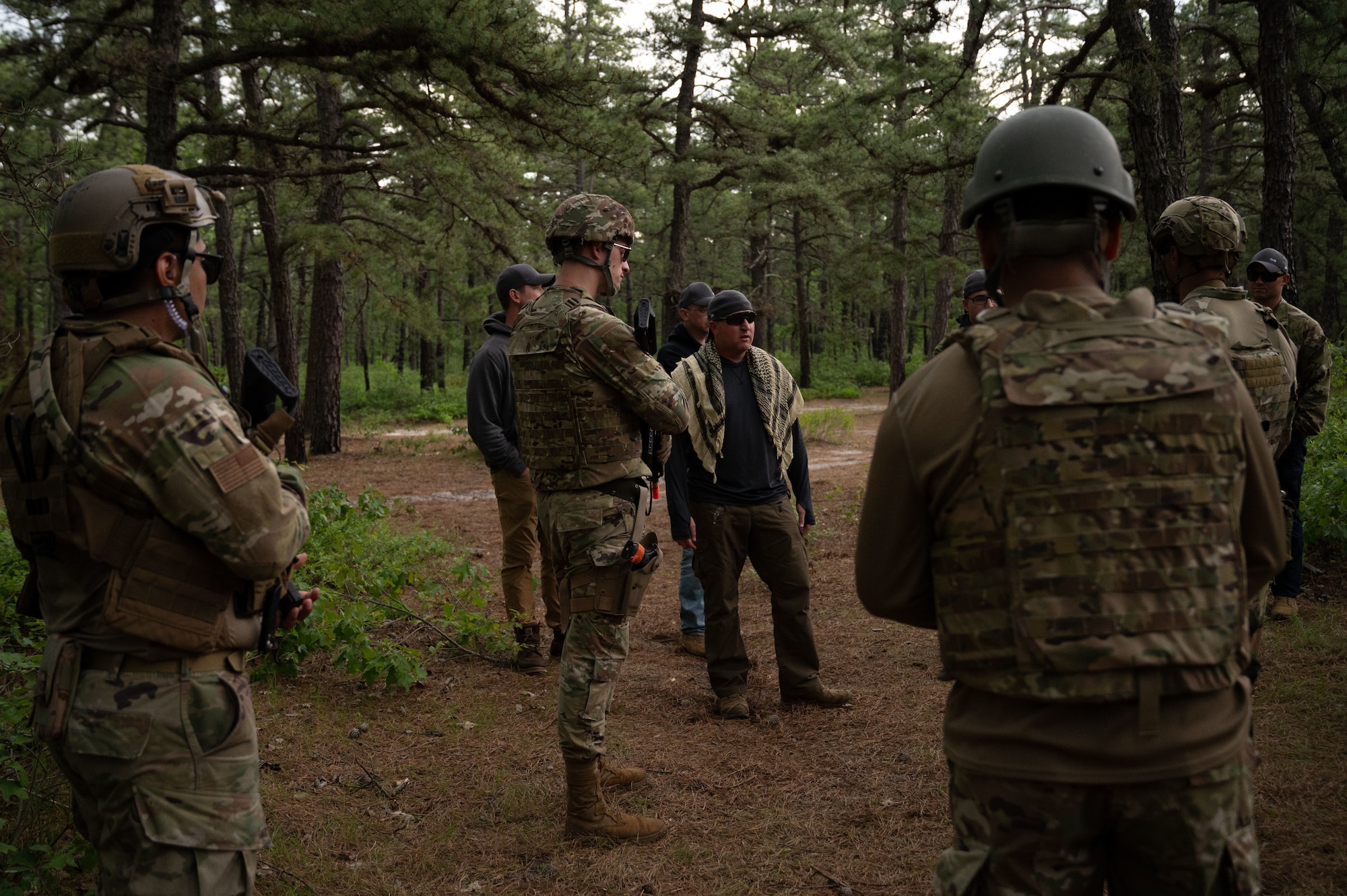 U.S. Air Force Airmen attending the Kish Airman Leadership School, diffuse a simulated verbal conflict with role-playing residents living near a mock deployed location.