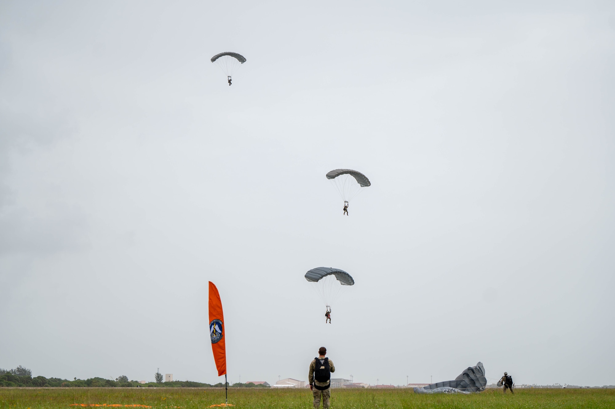 A pararescue specialist looks on