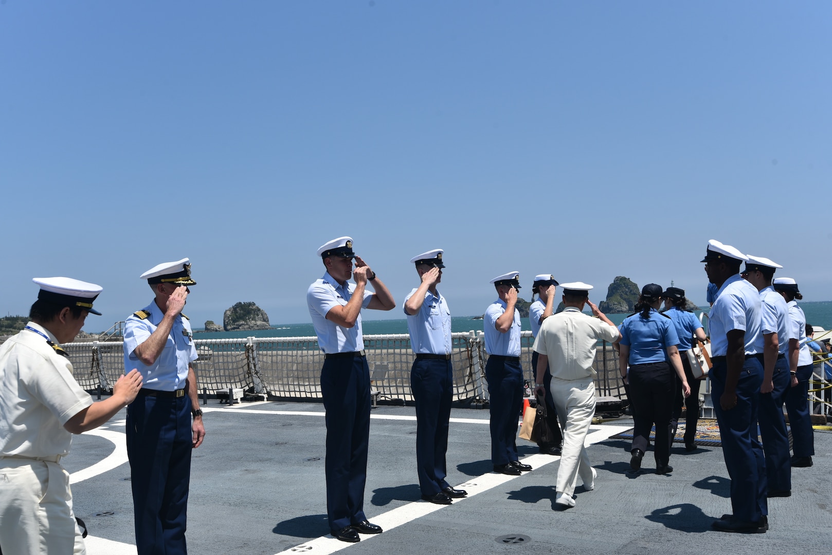 Legend-class U.S. Coast Guard Cutter Stratton (WMSL 752) Commanding Officer Capt. Brian Krautler (left) and side boys render hand salutes to departing Republic of Korea Coast Guard and Japan Coast Guard representatives following a tour of Stratton at Busan Naval Port, Republic of Korea, May 30, 2025. Stratton is deployed and assigned to Destroyer Squadron (DESRON) 15, the Navy’s largest DESRON and the U.S. 7th Fleet’s principal surface force. U.S. Coast Guard Cutter Stratton is deployed to the Indo-Pacific to advance relationships with ally and partner nations to build a more secure and prosperous region with unrestricted, lawful access to the maritime commons. (U.S. Coast Guard photo by Ensign Sarah Choe)