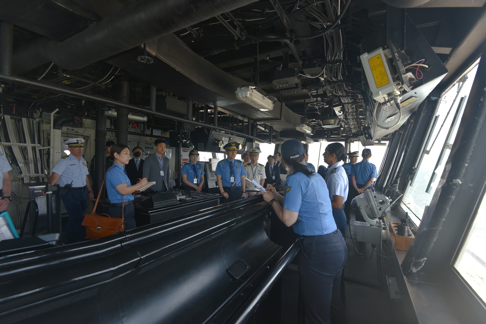 Lt. j.g. Sonia Sriniwass, center right, assigned to Legend-class U.S. Coast Guard Cutter Stratton (WMSL 752), explains bridge equipment to Republic of Korea Coast Guard and Japan Coast Guard representatives during a tour of Stratton in Busan Naval Port, Republic of Korea, May 30, 2025. Stratton is deployed and assigned to Destroyer Squadron (DESRON) 15, the Navy’s largest DESRON and the U.S. 7th Fleet’s principal surface force. U.S. Coast Guard Cutter Stratton is deployed to the Indo-Pacific to advance relationships with ally and partner nations to build a more secure and prosperous region with unrestricted, lawful access to the maritime commons. (U.S. Coast Guard photo by Ensign Sarah Choe)