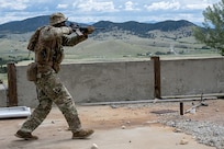 A Security Forces Airman clears an area during a field training exercise at  Ft. William Henry Harrison, Helena, Mont., June 4, 2025.