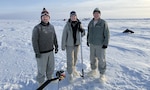 In February 2025, Arctic researchers William Jenkins, U.S. Navy Lt. Caroline Kelly, and Benjamin Reeder (left to right) conducted cryoacoustics experiments on sea ice floating in the Arctic Ocean to improve current and future U.S. naval operations in this growingly contested environment. (Courtesy photo from Mike Demello, Arctic Submarine Laboratory)