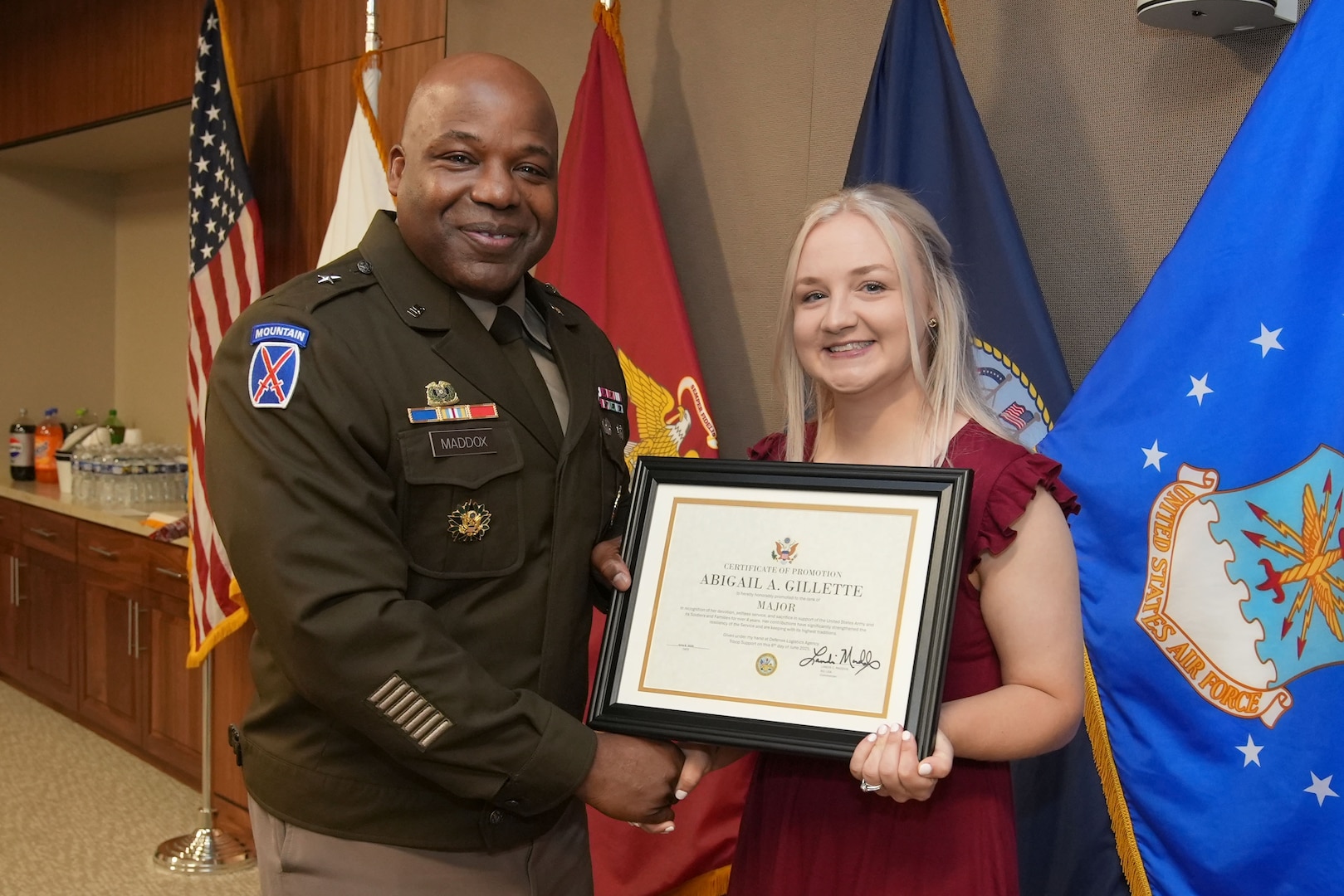 DLA Troop Support Commander Army Brigadier General Landis Maddox honorary promotes Abigail Gillette to the rank of Major during the promotion of her wife Captain Shannon Duley in Philadelphia. Photo by Edward Maldonado