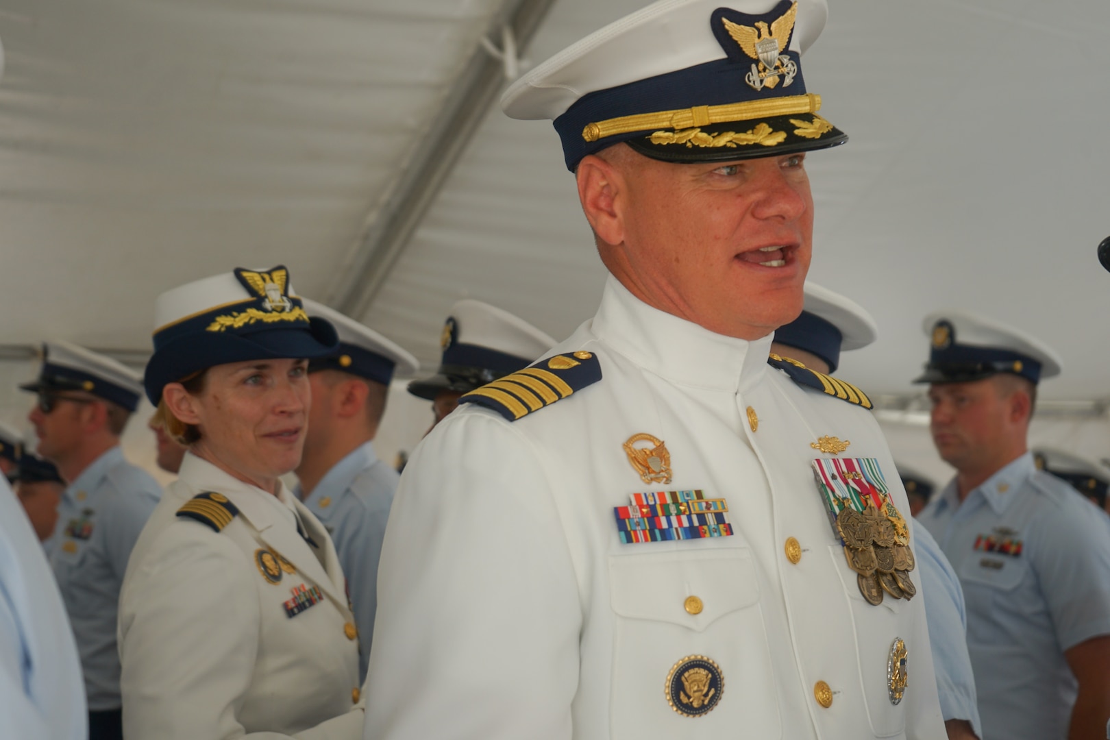 Capt. Jonathan Carter, outgoing commanding officer of Cosat Guard Cutter Stone (WMSL 758), and Capt. Anne O’Connell, incoming commanding officer of Stone, conduct a personnel inspection during the cutter's change-of-command ceremony in North Charleston, South Carolina, June 5, 2025. Stone falls under the command of Coast Guard Atlantic Area in Portsmouth, Virginia. (U.S. Coast Guard photo by Ensign Sarah Pearson)